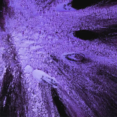 Abstract purple powder texture with intense lighting and detail