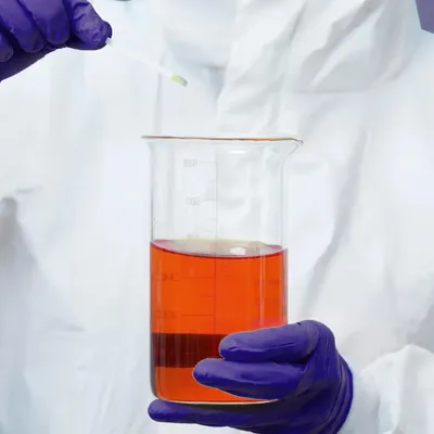 Closed development process in pharmaceutical research laboratory with scientists working on drug formulations