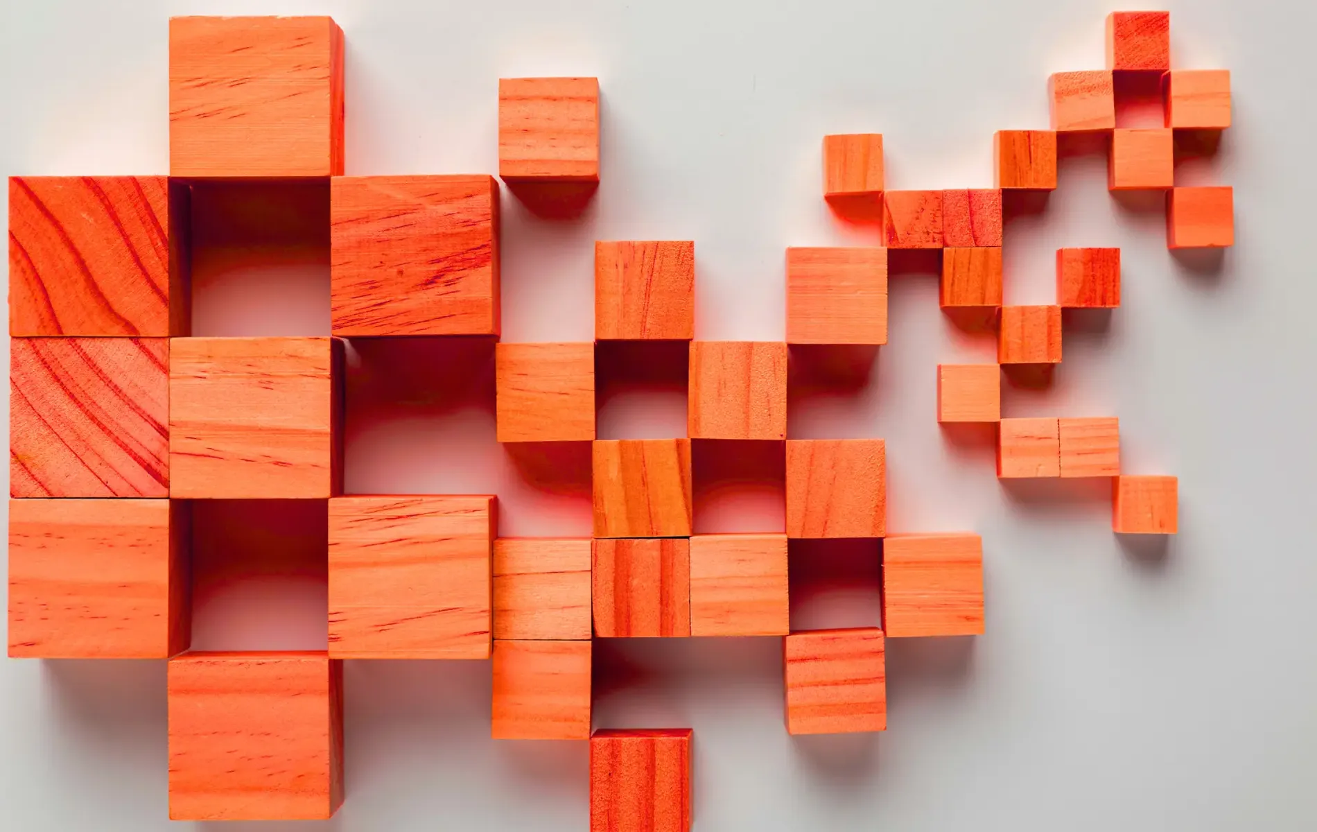 Orange wooden building blocks stacked in educational toy arrangement