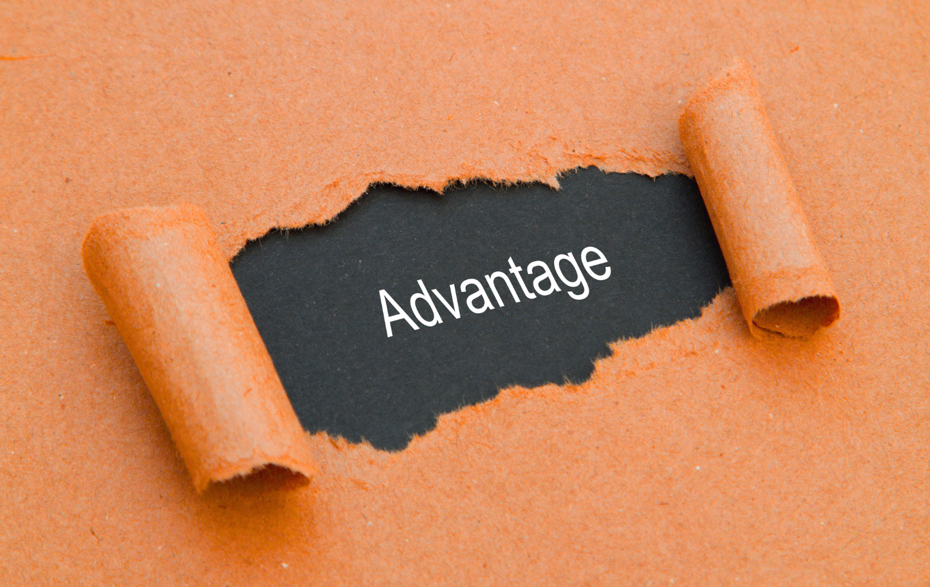 Strategic advantage concept with torn paper revealing hidden opportunity