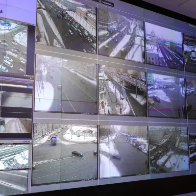 Large video wall displaying live feeds from multiple surveillance cameras