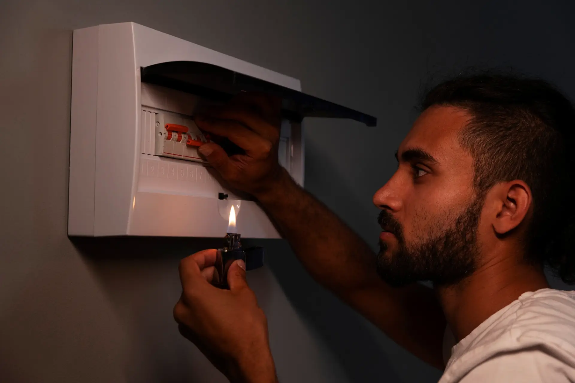 Employee goes to the circuit breaker during power outage.