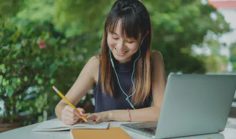 Woman happily studying