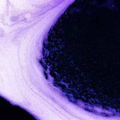 Abstract violet-black texture with circular gradient.