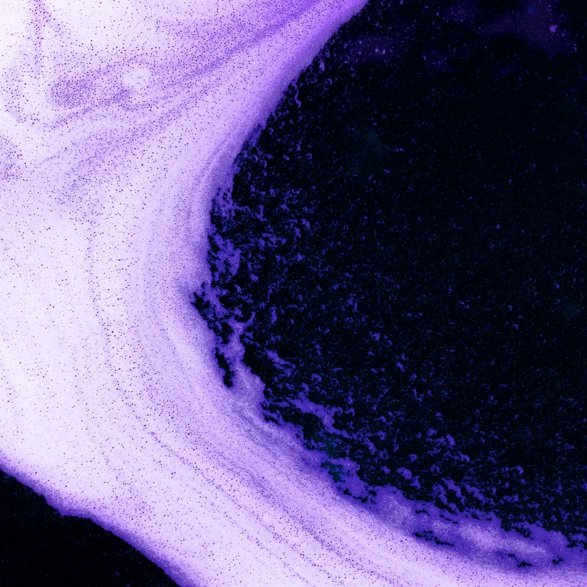 Abstract violet-black texture with circular gradient.
