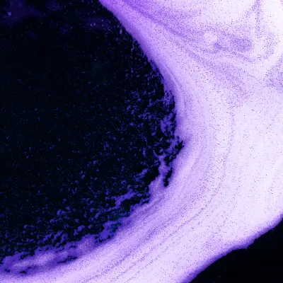 Abstract violet-black texture with circular gradient.