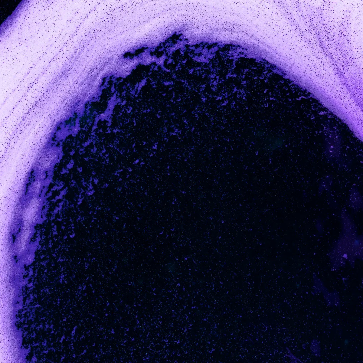Abstract violet-black texture with circular gradient.