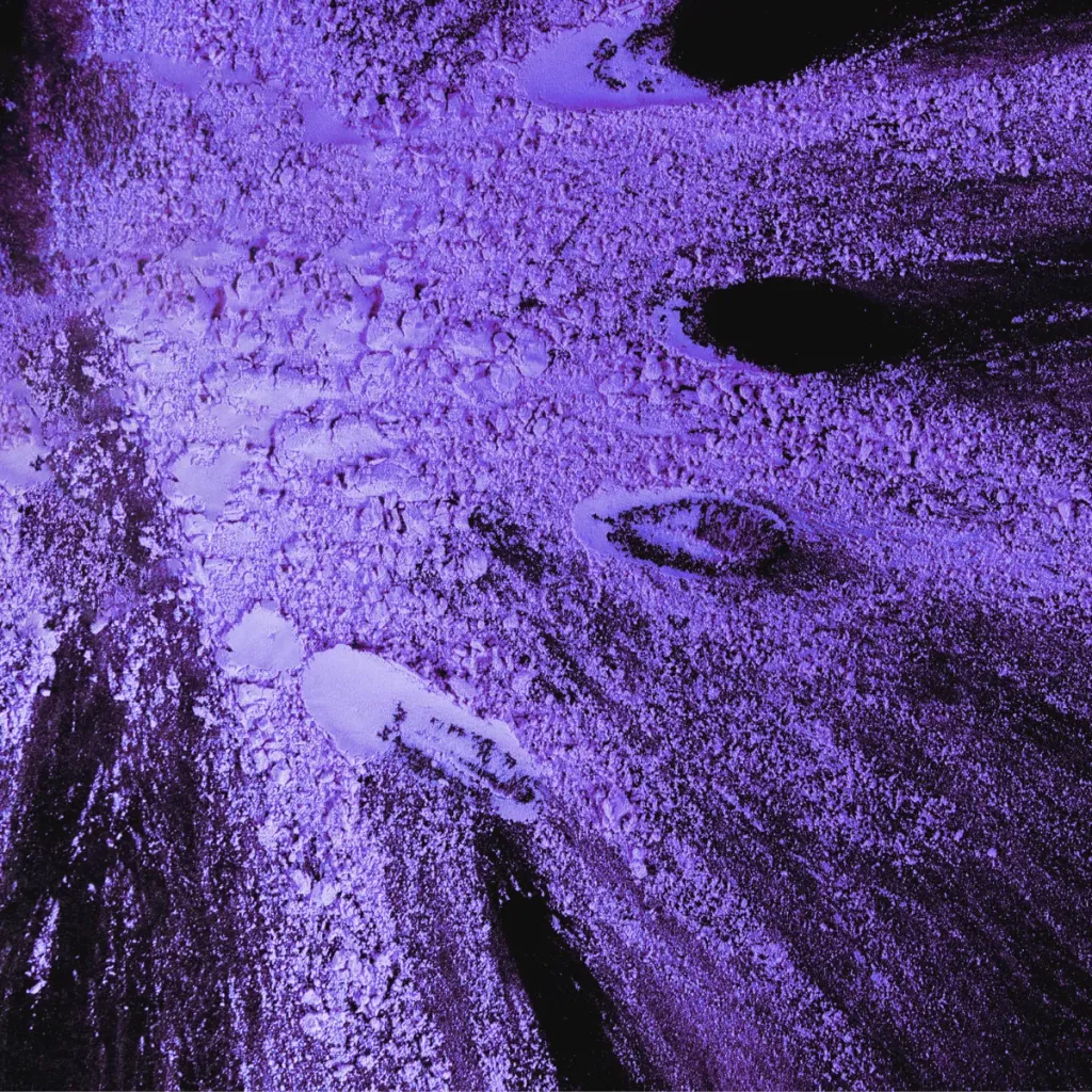 Abstract purple powder texture with intense lighting and detail