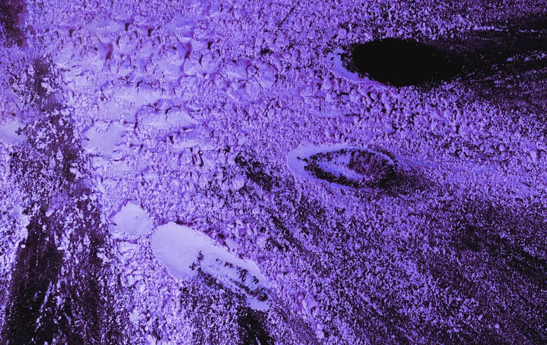 Abstract purple powder texture with intense lighting and detail