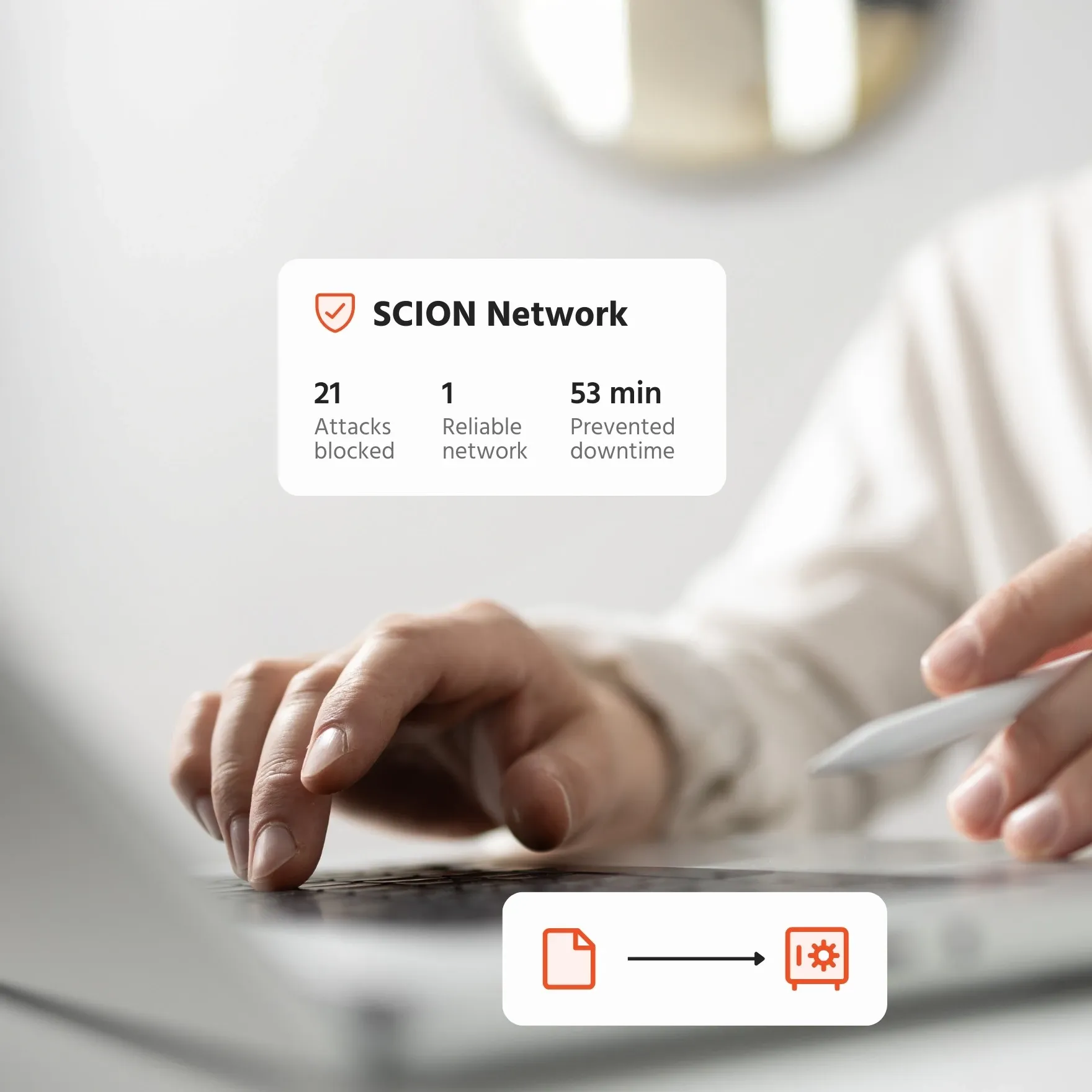 Hands on a laptop with SCION Network security statistics overlay.