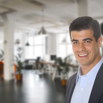 Portrait of Paul Cianci, co-founder and CEO of SealPact, dressed in business attire in front of a modern office background.