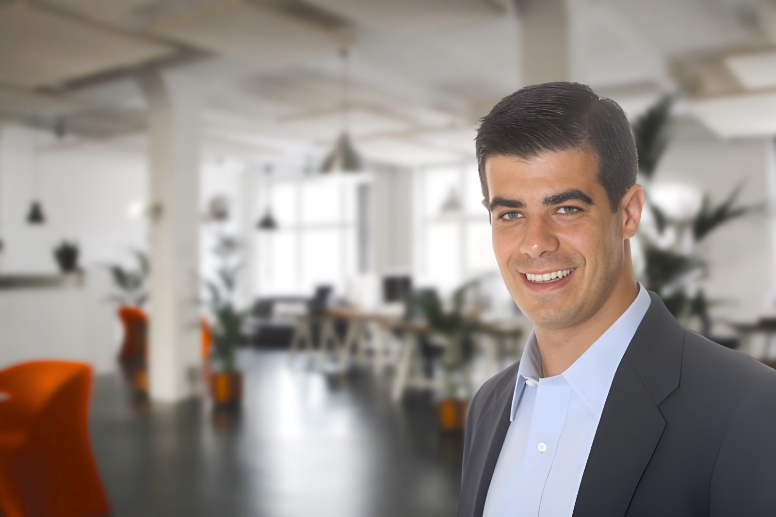 Portrait of Paul Cianci, co-founder and CEO of SealPact, dressed in business attire in front of a modern office background.