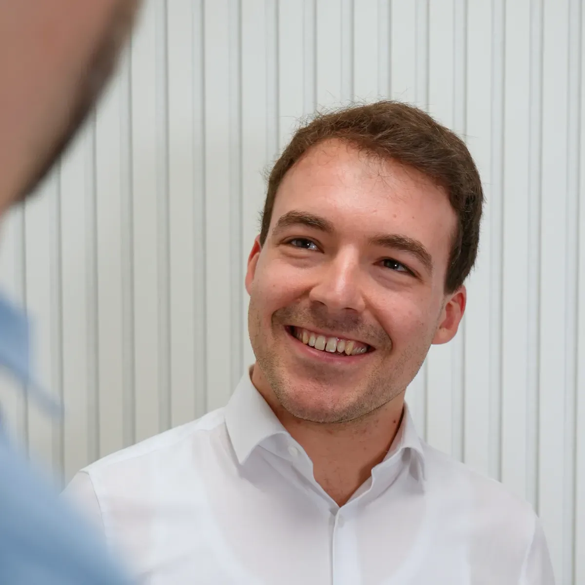 Smiling employee in conversation