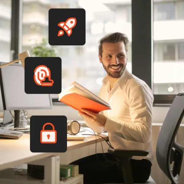 Person sitting in front of desk and smiling