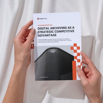 Two hands holding the whitepaper about digital archiving as a strategic competitive advantage