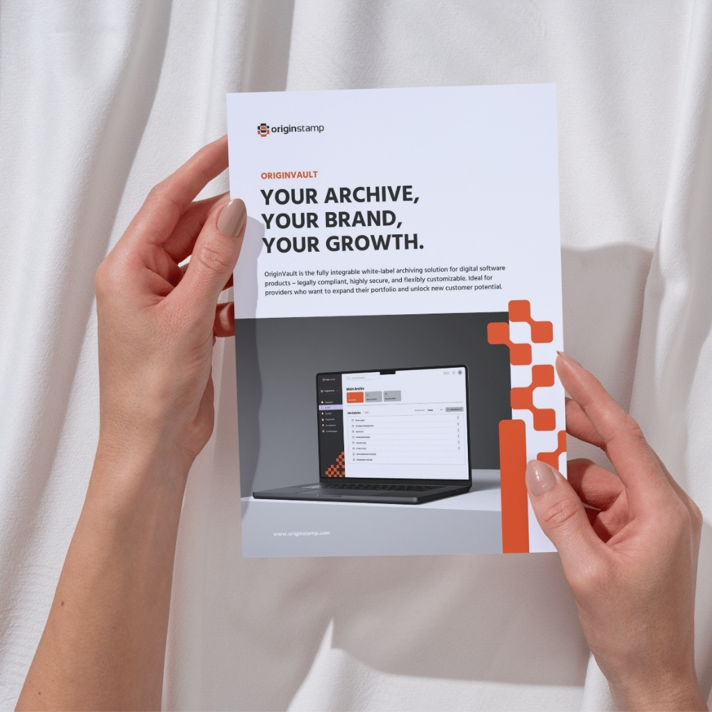 Two hands holding the whitepaper about OriginVault, the whitelabel archiving solution by OriginStamp